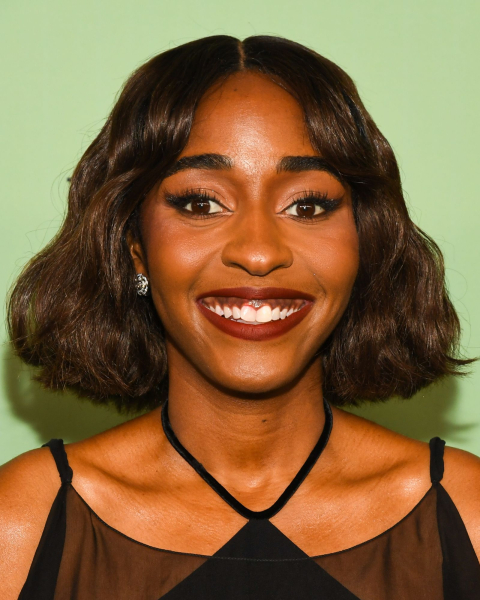 Ayo Edebiri with gothic lips on the red carpet